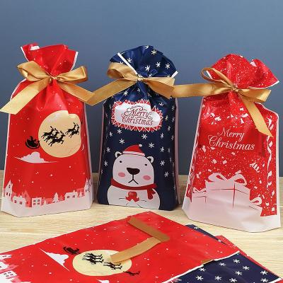 China 50Pcs Fashion Christmas Bags Drawstring Plastic Treat Bags Party Snack Bags For Xmas Birthday Gifts Supplies for sale