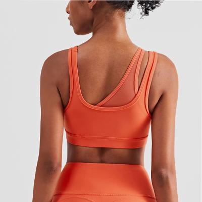 China Mesh Stitching Strappy Back Sports Bra Girls Elastic Bottom Padded Crop Top for sale