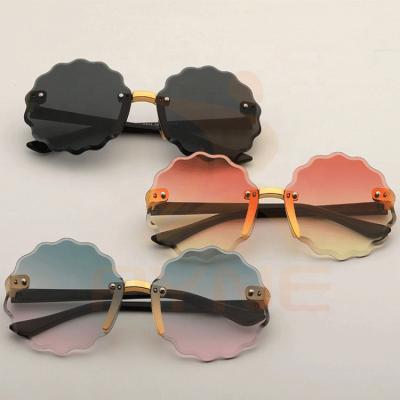 China Fashion Sunglasses Wholesale Luxury Unisex Kids Girls UV Round Flower Fashion Designer Sunglasses Custom Made Kids Sun Glasses 400 2021 for sale