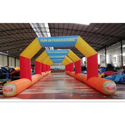 China Funny Sports Events Oxford Cheap Inflatable Arcade Tunnel Door Vault For Charity Events Fundraising for sale