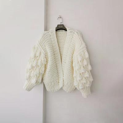 China Ladies Hot Caramel Anti-Wrinkle Wholesale Handmade Knit Pom Pom Sleeves Cardigan for sale