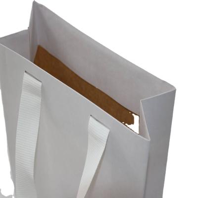 China Handmake Hot Sale Small White Paper Bag Packaging With Handles For Shopping for sale