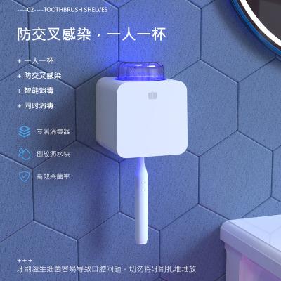 China Creative Wholesale Smart Toilet Toothbrush Holder Disinfection Storage Toothbrush Holder Set OEM for sale