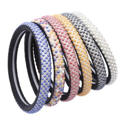 China Crystal Steering Wheel Cover Factory Customized Ladies Diamond Car Grip Cover New Ice Beads PU Non-Slip Leather Steering Wheel Covers for sale