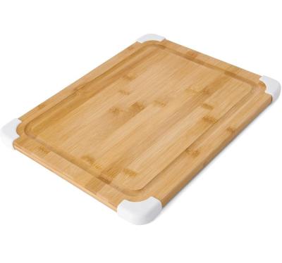 China Sustainable 11X14 Inch White Nonslip Bamboo Cutting Board With Juice Groove Wood Chopping Board for sale