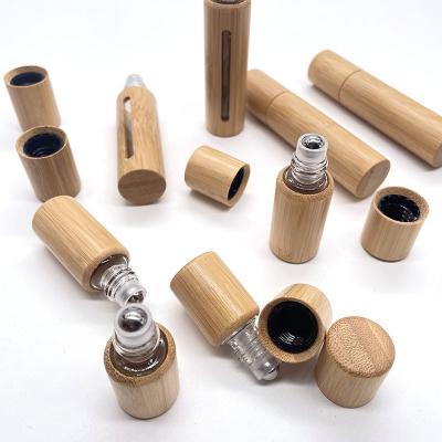 China Recyclable Bamboo Wood Skylight Covered Bamboo Bead Bottle for Perfume/Essential Oil for sale