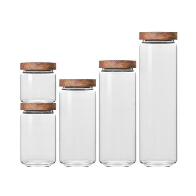 China Capacidad personalizada Envasado sellado borosilicato redondo transparente recipientes de vidrio de embalaje Jar con tapa de madera en venta