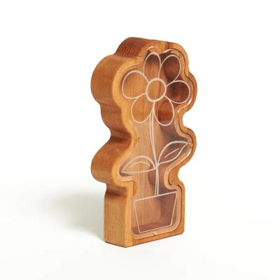 Cina 202407 Regalo di Pasqua Rocket Coin Bank per bambini Fabbricazione a mano Pianta di fiori di margherita di legno Piggy Bank in vendita