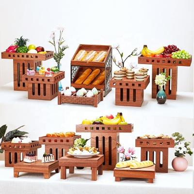 China Catering Decorative Hotel Bread Dessert Food Wood Rack Buffet Sweet Sushi Display Stand for sale