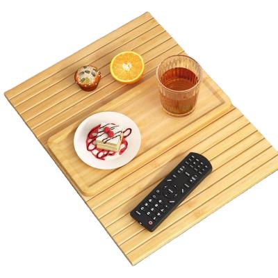 China Stocked Bamboo Sofa Arm Tray Table Large Couch Cup Holder Tray for Phone Cups Remote for sale