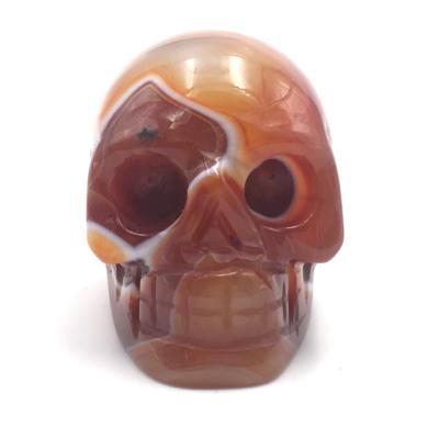 China Europe & American Indoor Head Figurines Accessories Red Agate Stone Skulls Statue Crafts for sale