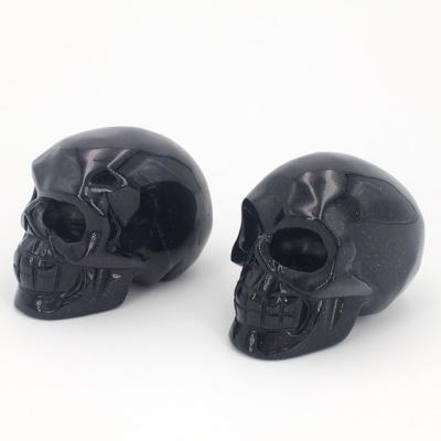 China Europe & American Bulk Wholesale Polished Blue Gold Sand Stone Carved Skulls for sale