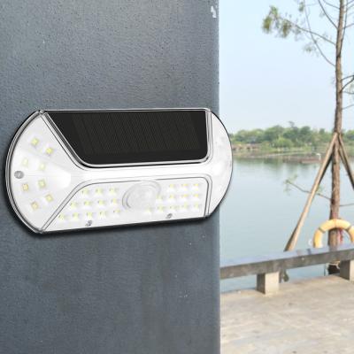 China High Quality IP44 Outdoor Garden Garden Lamp 40 LED Waterproof Motion Sensor Wall Solar Powered Garden Lights for sale