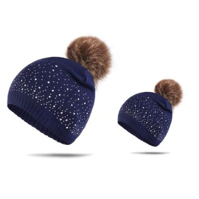 China JOINT Hot Knit Hat Rhinestones Soft Stretch Cable Beanie Hat For Mother And Kids for sale