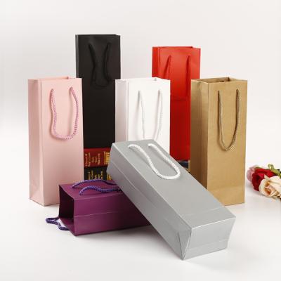 China Wholesale Recyclable High End Colorful Kraft Paper Shopping Gift Bag Liquor Packaging Recyclable Twisted Nylon Handle Bag For Wine for sale