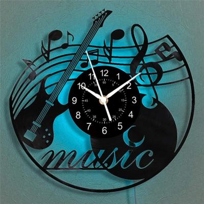 China Antique Style Gift for Music Musical Black Luminous Decorations Wall Clock Disc Rock Lovers Plastic Wall Clock for sale