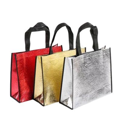 China Promotional Custom Film Embossed Handled Non Woven LOGO Non-Woven Bag Laser Metal Tote Bag for sale