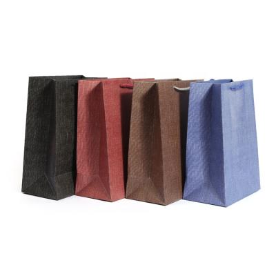 China New Design Recyclable Luxury Black Paper Candy Paper Shopping Gift Packaging Bags With Handles for sale