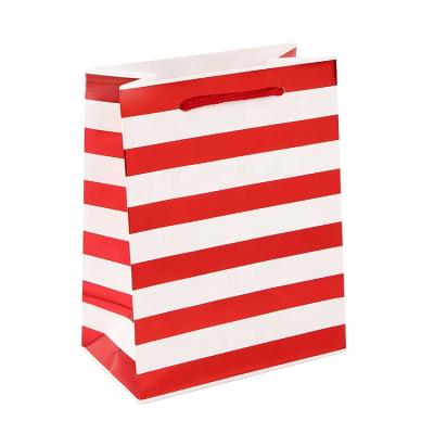 China 2021 Paper Bag Suppliers Customized Stripe 210g White Paper Shopping Bag Recyclable Hot Stamping Packaging for sale