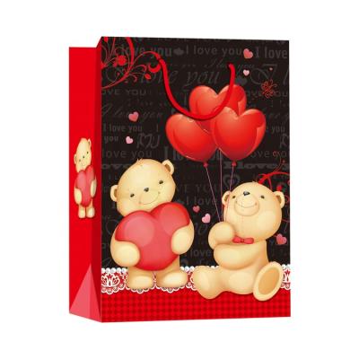 China Custom Recyclable 31*41*12 Cm Printed Bear Kids Birthday Kraft Paper Gift Bag for sale