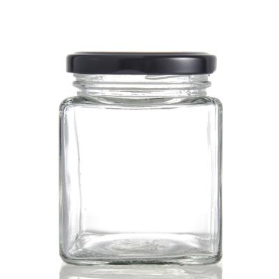 China Empty Square Amber Glass Jars Honey Jar Glass Frascos de vidrio Glass freshness storage square for honey for sale