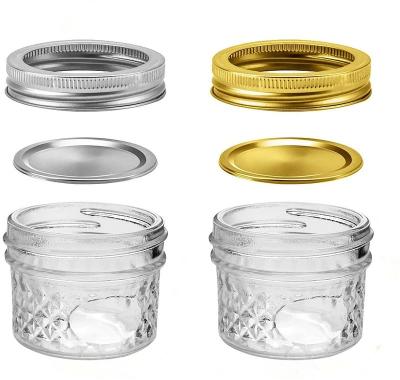 China Canned Food In Stock 100ml 4oz Shape Mason Rhombic Engraving Glass Jar Jam Glass Honey Jar With Silver Cap for sale