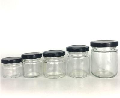 China Small Clear Circular Circular Jam Canned Food Wholesale Container Glass Jar With Metal Tin Cap for sale