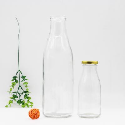 China Beverage Food Grade Empty Round 1L 1000ml Milk Bottle Clear Glass With Metal Screw Lid for sale