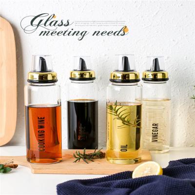 China Wholesale High Quality 500ml 600ml Freshness Preservation Kitchen Use Oil Containers Glass Dressing Dispenser Bottle With Pourer Mist Lid for sale