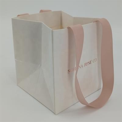 China Handmade Custom Luxury Foiled Paper Bag Glossy Finish Rose Gold Logo For Gift Packaging With Handles for sale