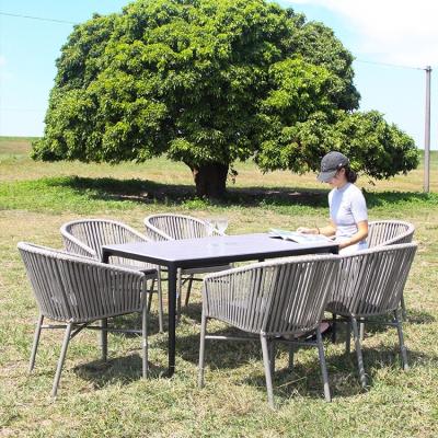 China Modern Modern Outdoor Furniture Webbing Dining Garden Set 4-6 Seaters Aluminum Rope Wicker Chairs And Tables With Marble Rock Plate Top for sale