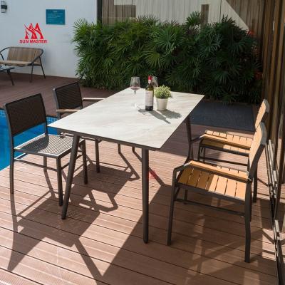 China Modern 4-Piece Indoor and Outdoor Metal Patio Plastic Wood Conversation Set Aluminum Cast Chair with Contemporary HPL Table Design for sale