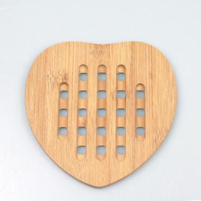 China Viable Heat Resistant Heart Shaped Bamboo Pot Holders Tripod Bamboo Coasters for sale