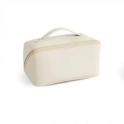 China Durable Large Capacity Travel Cosmetic Bag Multifunctional Storage Makeup Bag PU Leather Makeup Bag for sale