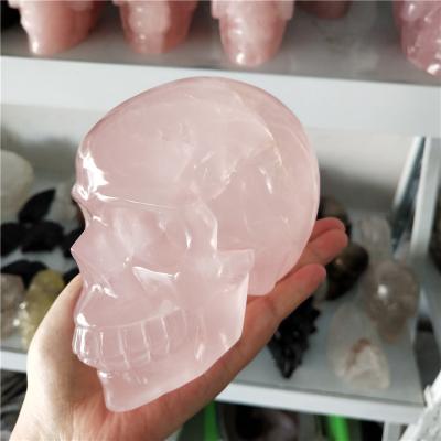 China Wholesale Europe Hand Carved Crystal Skull Natural Rose Quartz Human Head Human Head for sale