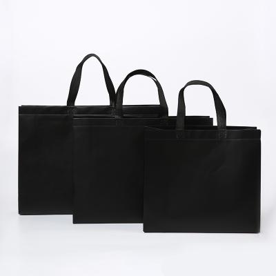 中国 Custom top quality promotion price laminated luxury handled non-woven black tote shopping bag with printed logo 販売のため