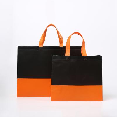 China Customized luxury shopping bags with logos orange nonwoven shopping bag zu verkaufen