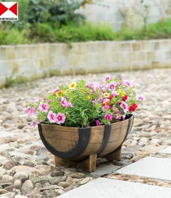 China Eco - Friendly Plastic Faux Wooden Garden Barrel Planters for sale