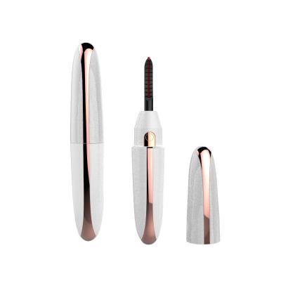 China Whole Sales HEATING Shape Rechargeable Mini Portable Pen Shape Silicon Comb Passionate Eyelash Curler for sale