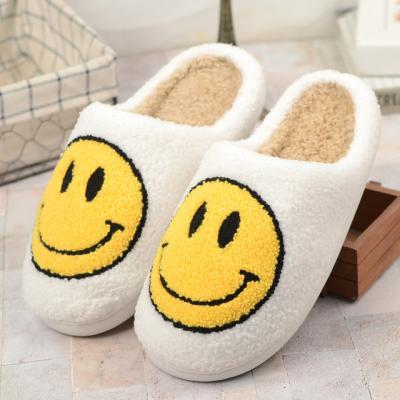 China 2022 LOGO Smiley Face Anti-skid Smiley Face Indoor Furry House Slippers Cute Smile Home Slipper Plush Toy Wholesale For Guests for sale