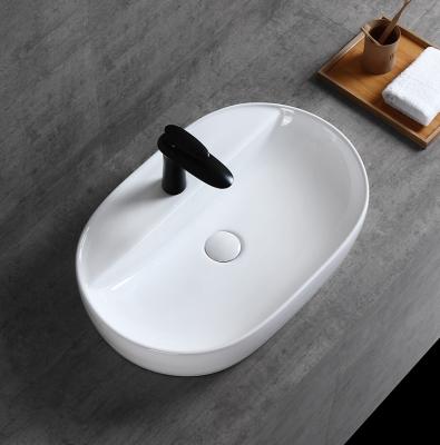 China Eco-friendly 2022 Amazon Hot Sale Hand Wash Basin Single Hole Ceramic Faucet Oval Top Mount Bathroom Sink for sale