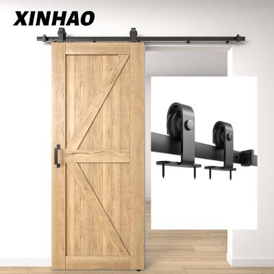 China Modern XINHAO Soundproof Interior Wrought Iron Sliding Door Hardware 6.6 Feet Rail Hanging Single Slide Kit Sliding Barn Door Hardware for sale