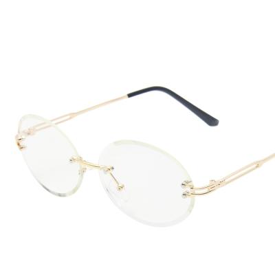 China Fashion Sunglasses Wholesale Designer Clear Oversized Custom Women Rimless Sunglasses Glass Diamond Cut Colorful Ellipse Rimless Sun for sale