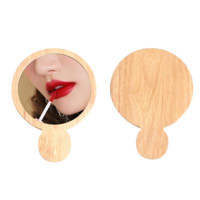 China Personalized Custom Logo Small Round Wooden Cosmetic Contract Mirror Surrounds Pocket Portable Wooden Handheld Makeup Mirror for sale