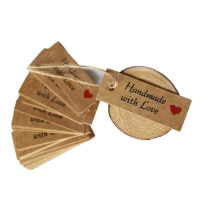 China Best Selling Recyled Product Customized Brown Hand Swing Kraft Paper Tag With Strings Love for sale