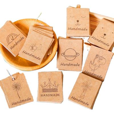 China High Quality Recyled Recycle Cute Bear Crown Mix Designs Custom Hang Kraft Paper Tag With Strings for sale