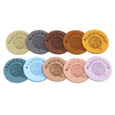 China Washable high quality round 25*25mm for hat leather tag customized logo leather tags for sale