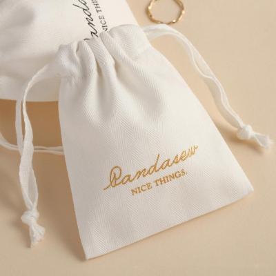 China Recyclable Small Packaging Bags Pouch Cotton Cloth Earrings Ring Necklace Jewelry Bag With Customized Logo for sale