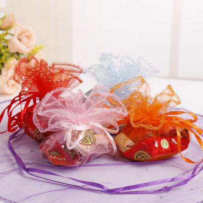 China Recyclable Custom Printed Round Bottom Gold Organza Gift Pouch Bag for sale