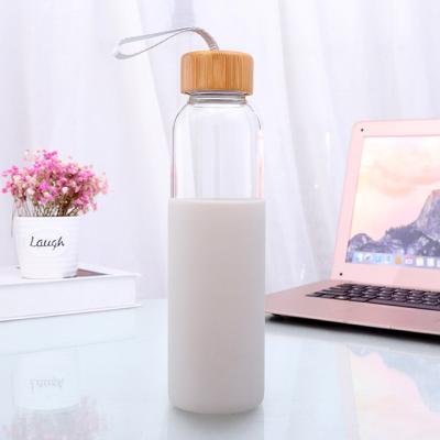 China Sustainable Custom Bamboo Cover Silicone Sleeve Insulated Borosilicate Glass Water Bottle for sale